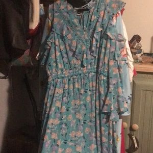 Fun spring dress. Long with 3/4 sleeves and cut outs at shoulders.